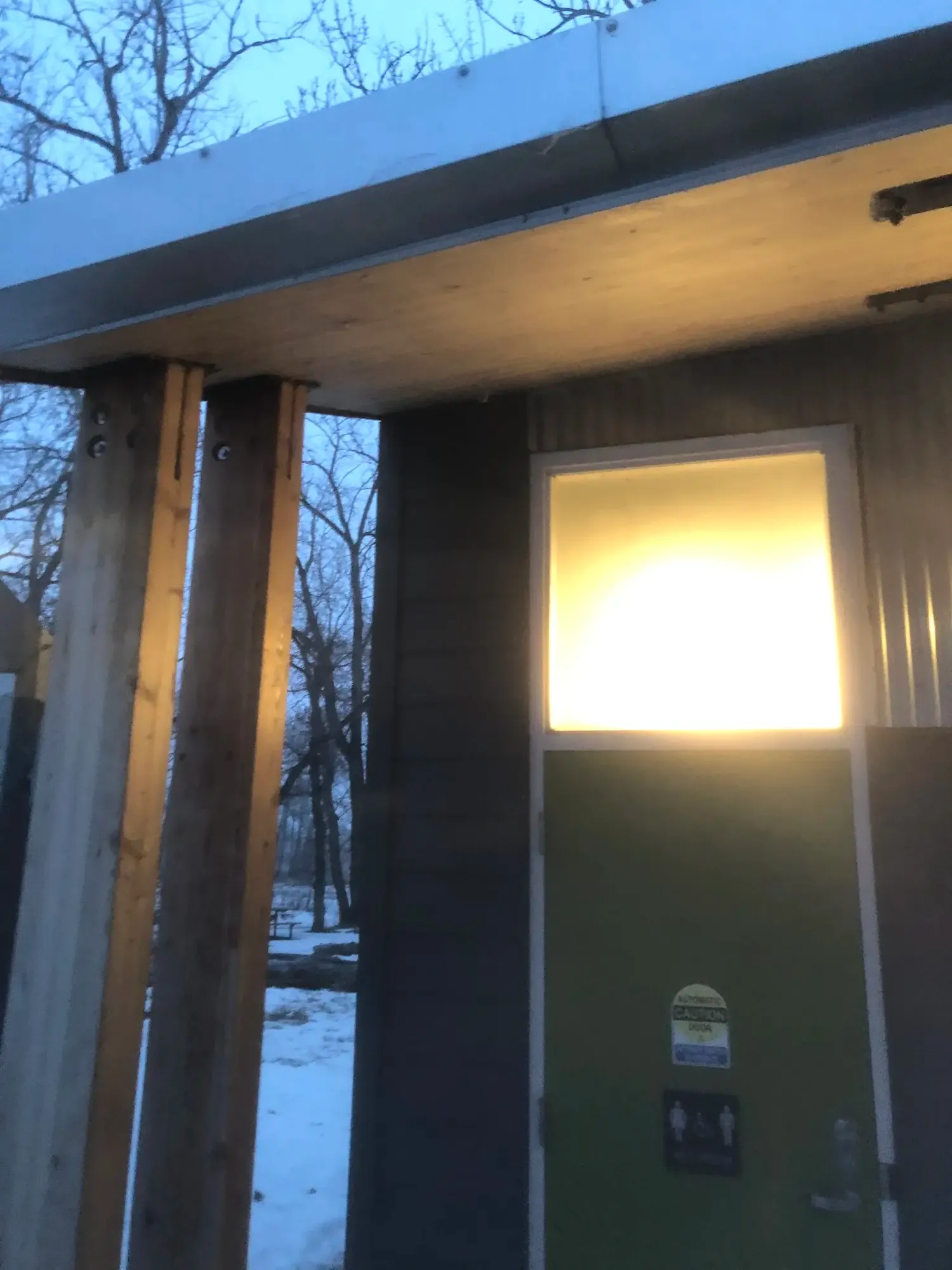 Dark siding and post trim detail on a building corner